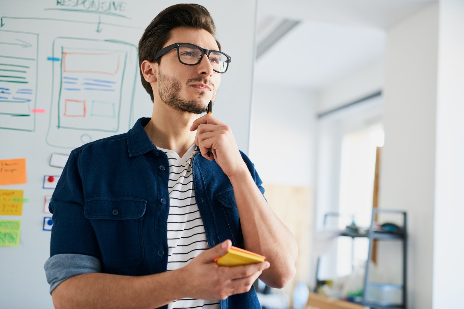 Geek, web designer planning website layout